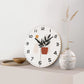 Horloge murale blanche à motif de pot de fleurs